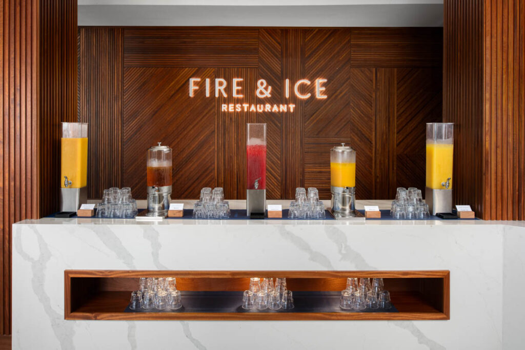 Buffet area at Fire & Ice with fruit, juices on display.
